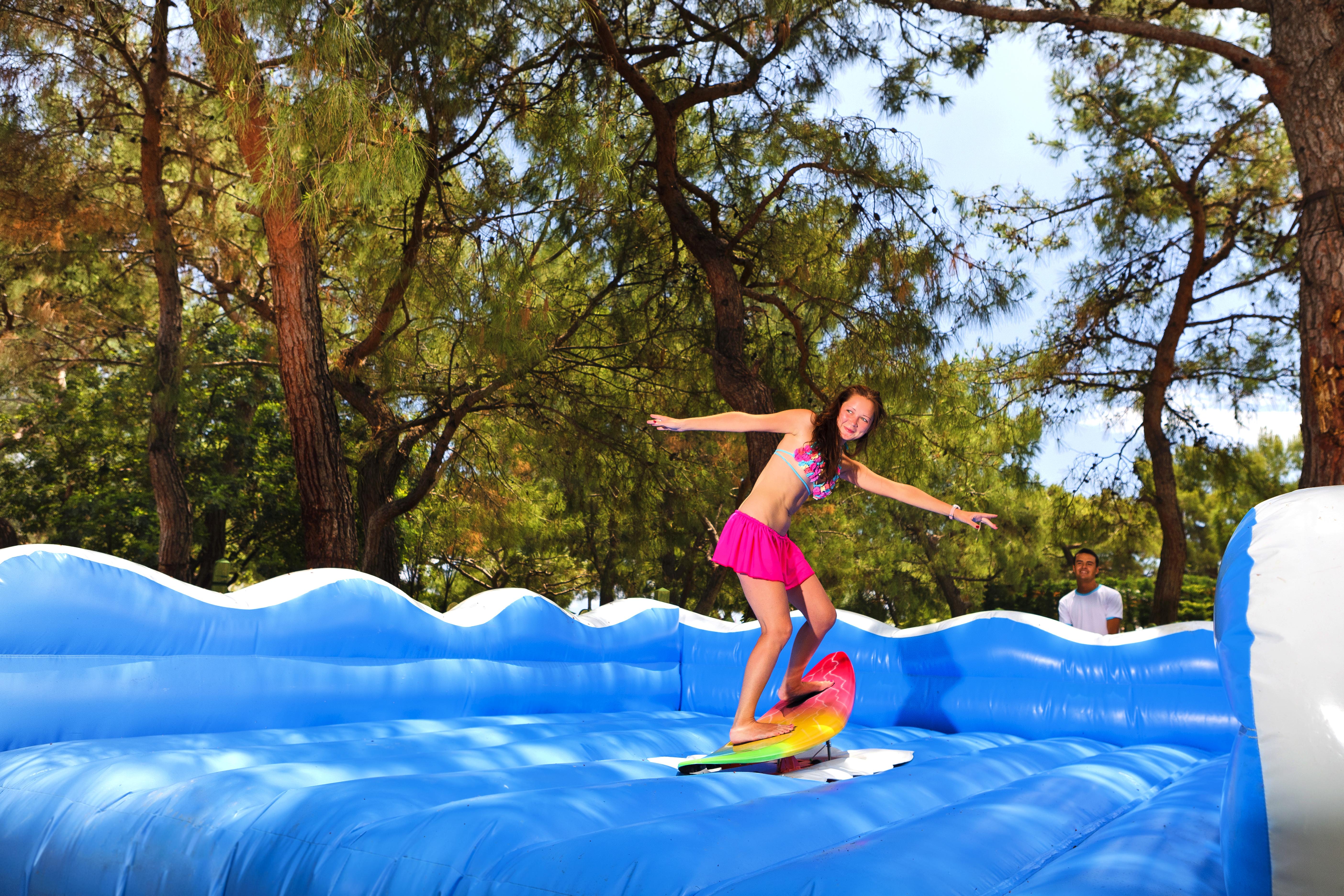 Marti Myra Hotel Tekirova Exterior foto A girl on an inflatable water slide